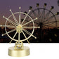Pariserhjul med roterande evighetsmaskin och lampor för hem- och kontors dekorationer