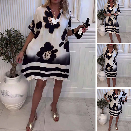 Löst tryckt klänning med djup V-ringning för kvinnor