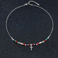 Färgglatt halsband med pärlor och kors