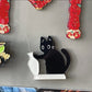 Kylskåpsmagnet med svart katt